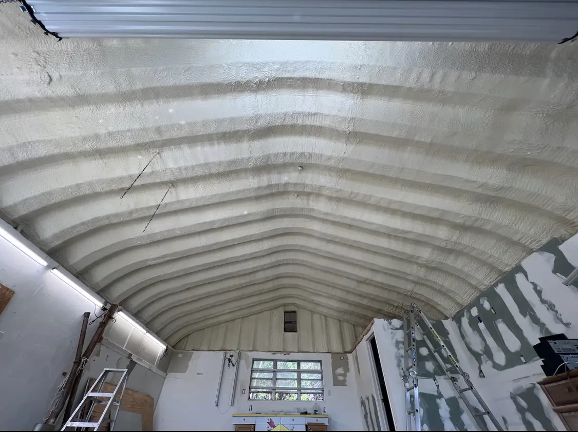 Spray polyurethane foam applied to the underside of a metal roof deck in Secaucus